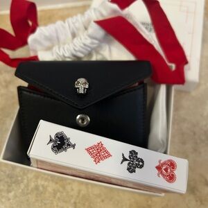 Brand new Alexander McQueen playing card set single in leather pouch with skull